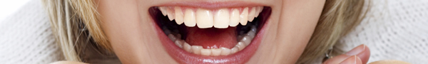 Bridge Dentures, Bridges Dentist, teeth implant costs, dental bridges lake forest A female client of Lake Forest Dental smiling to happily show off her bridge dentures